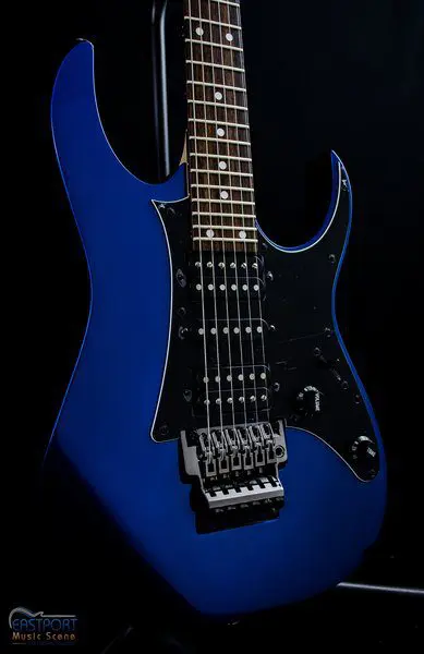 A blue electric guitar with black trim and chrome hardware.