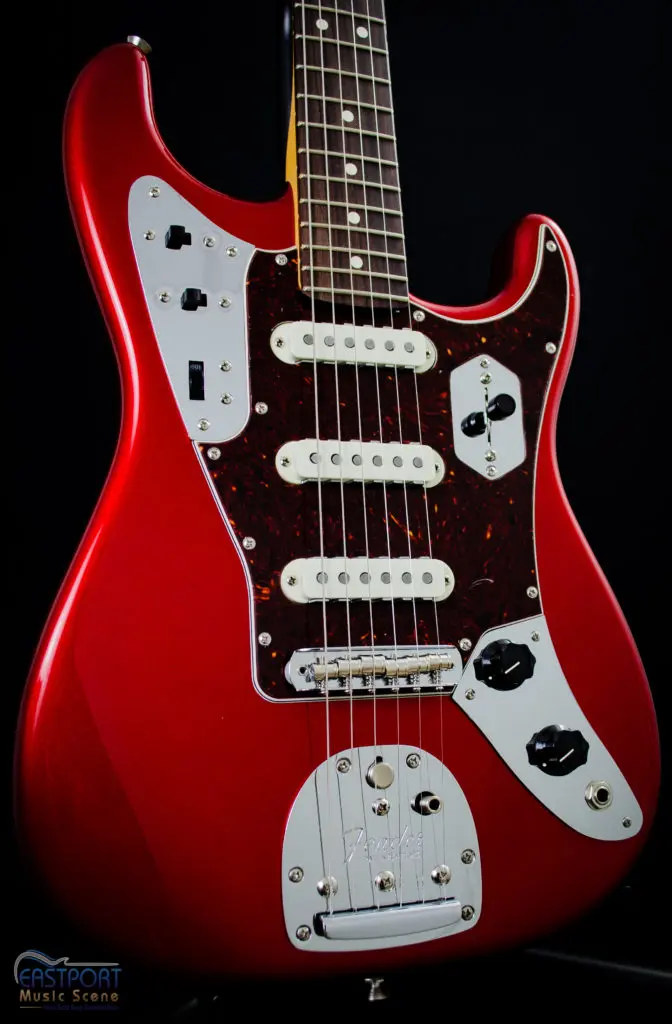 A red guitar with white accents and black trim.
