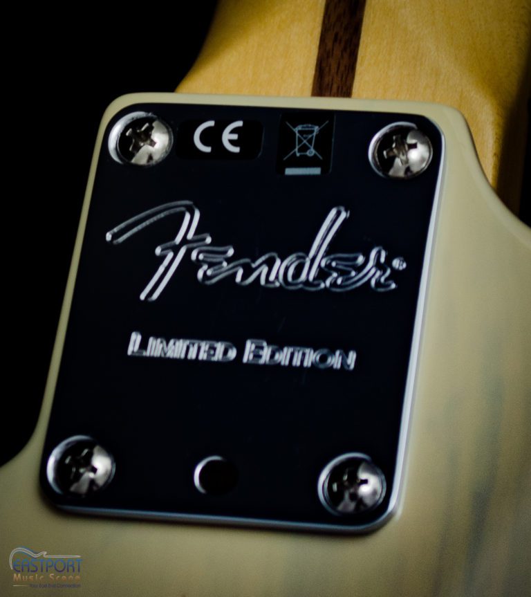 A close up of the fender logo on a guitar