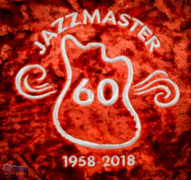 A red and white logo for jazzmaster 6 0