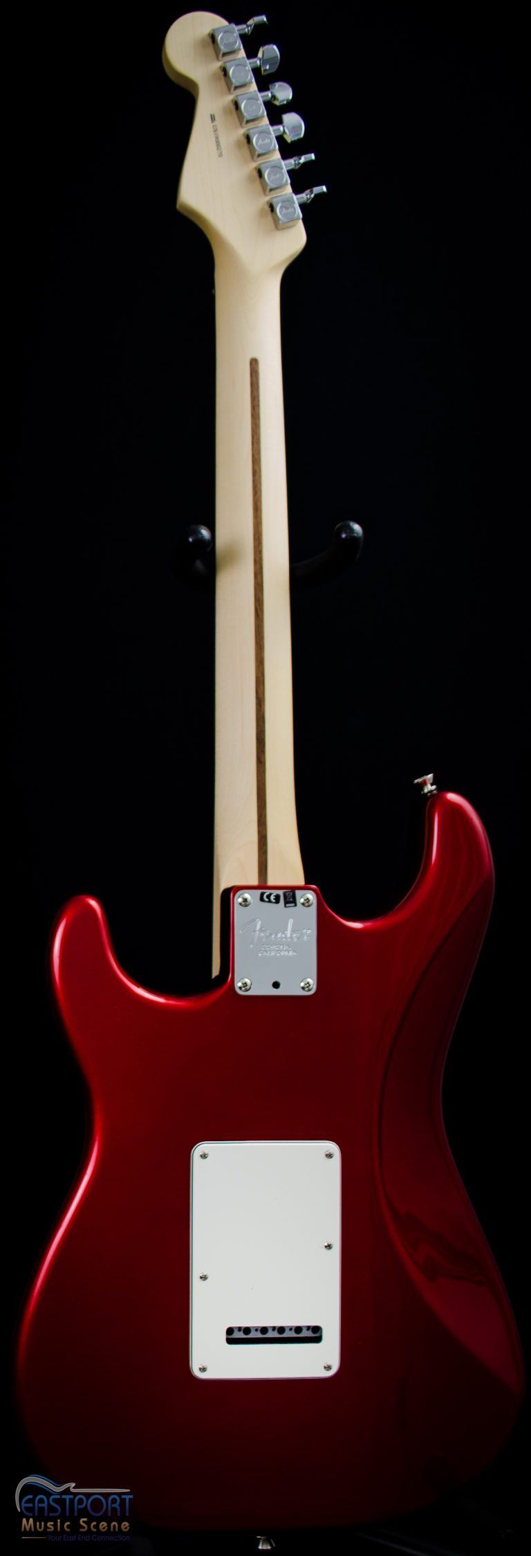 A red electric guitar with two white strings.