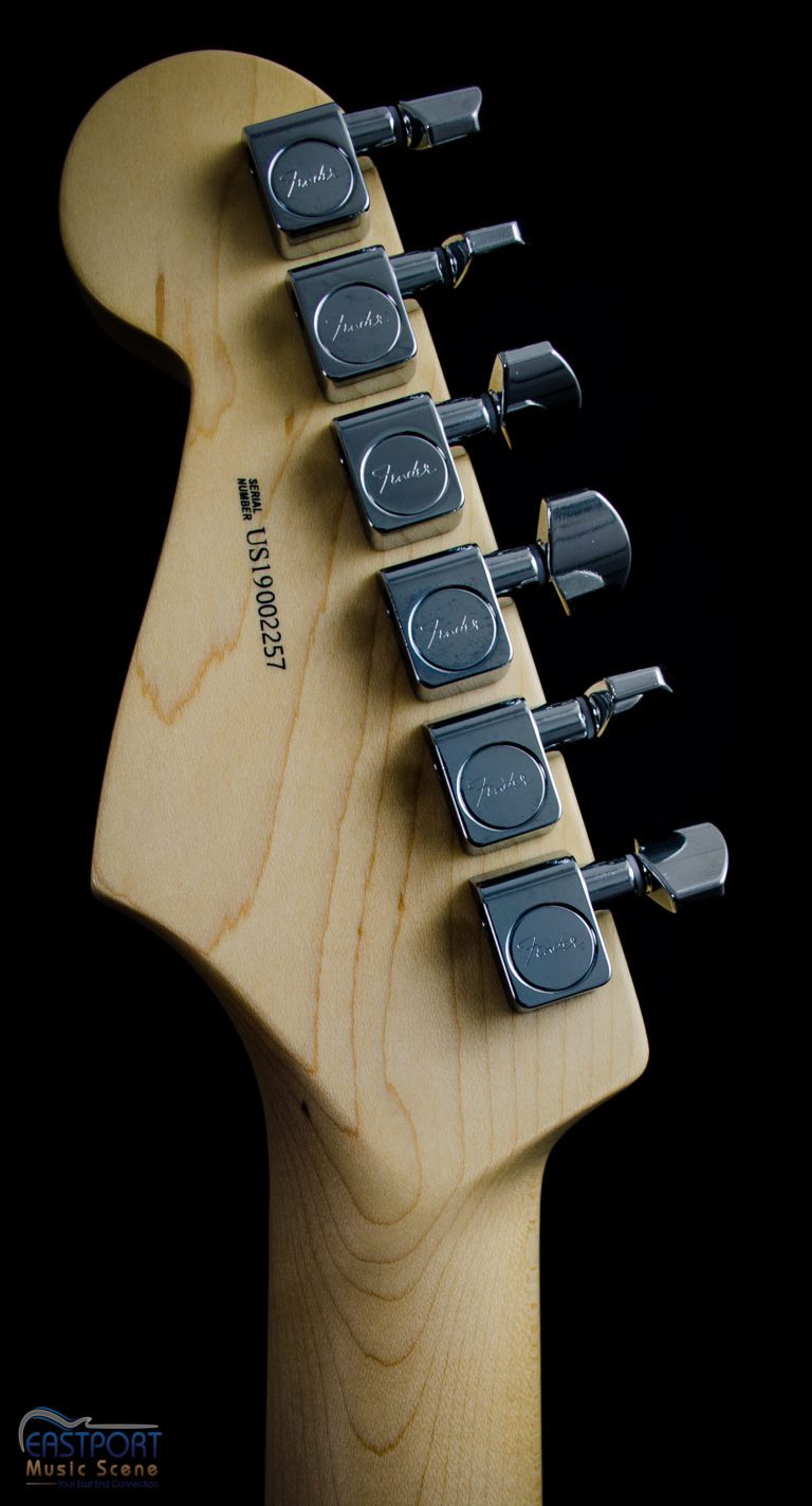 A guitar with the headstock and tuners attached.