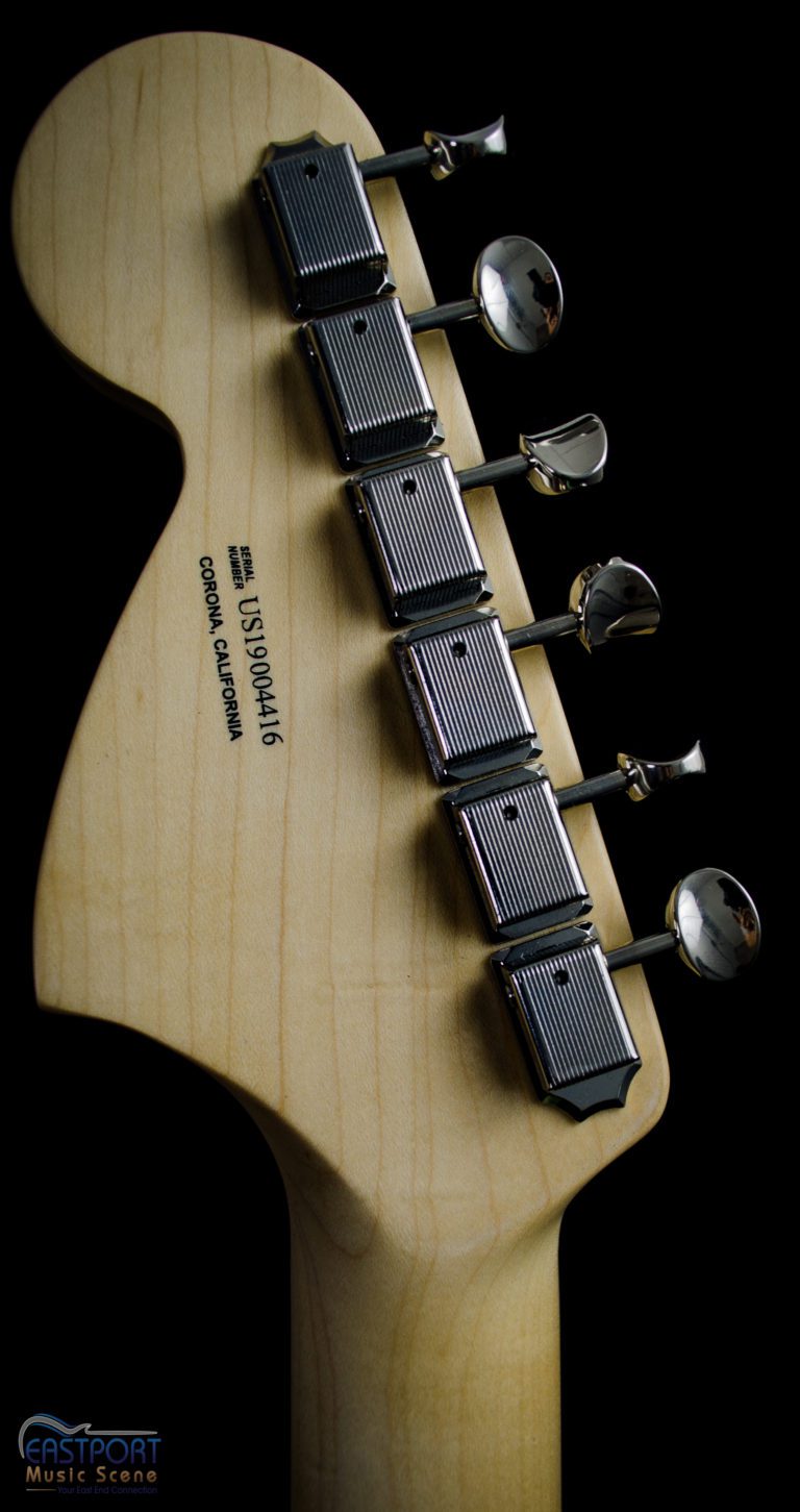 A close up of the back of an electric guitar