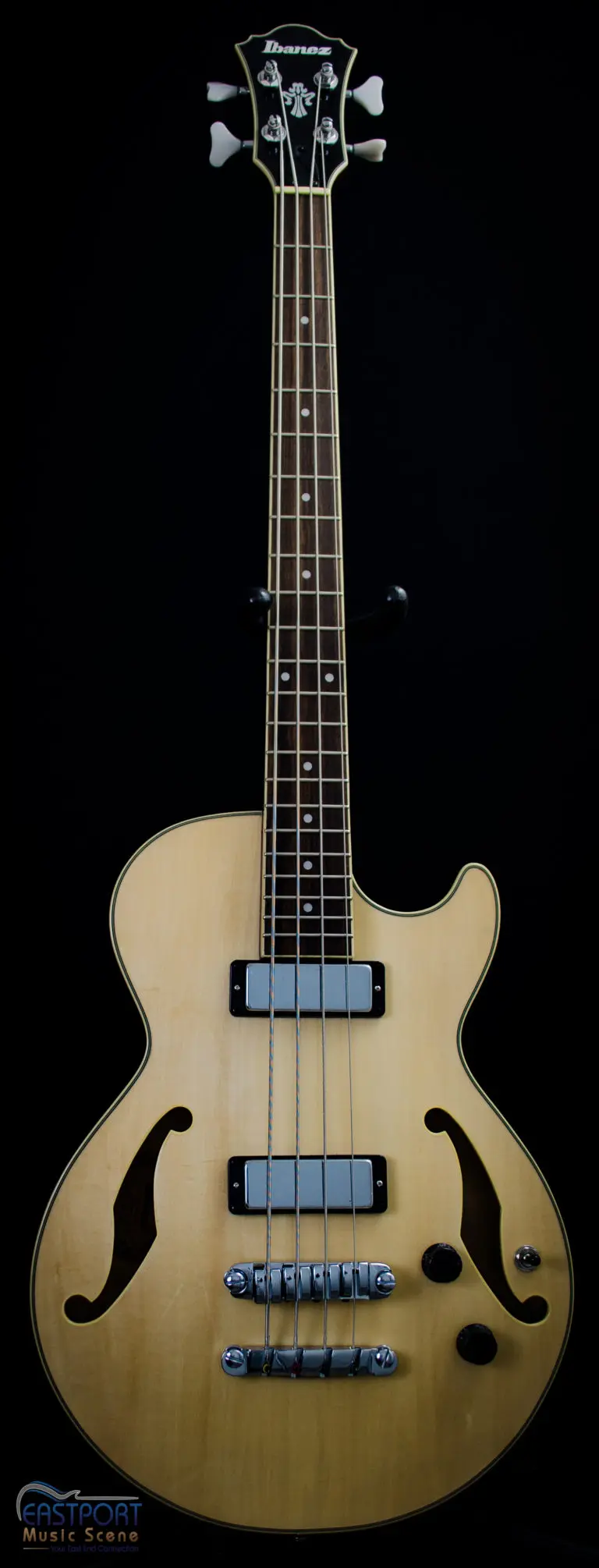 A guitar with four strings and two pickups.