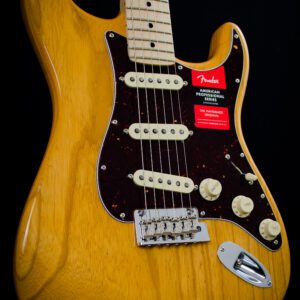 A close up of the neck and body on an electric guitar.