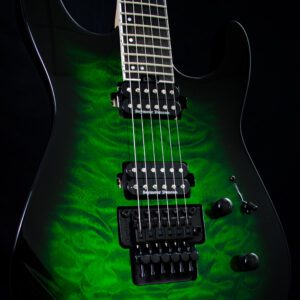 A green electric guitar with black trim and six strings.