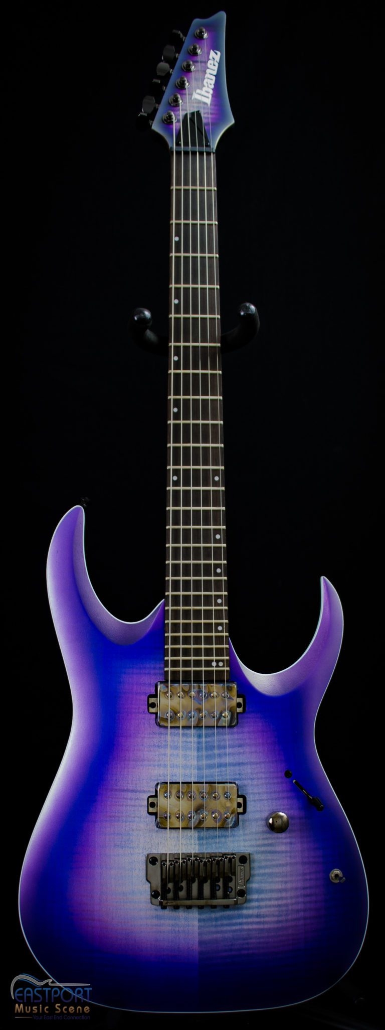 A purple electric guitar with black trim and strings.