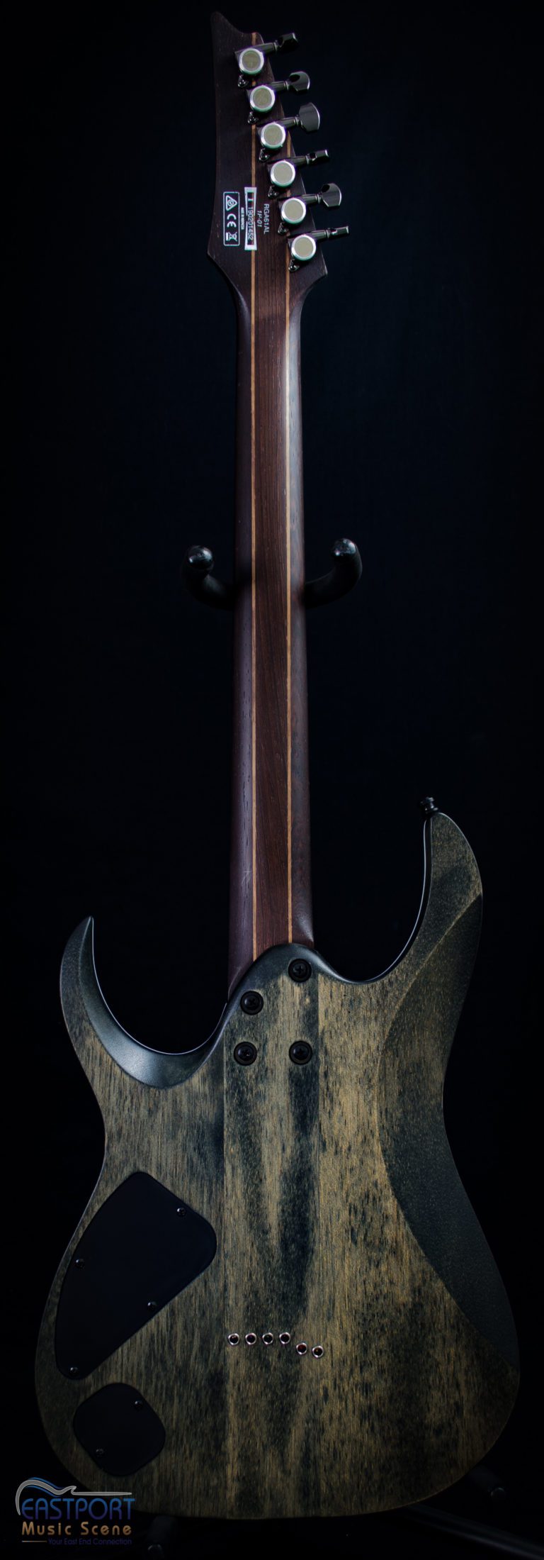A guitar with a wooden handle and metal head.