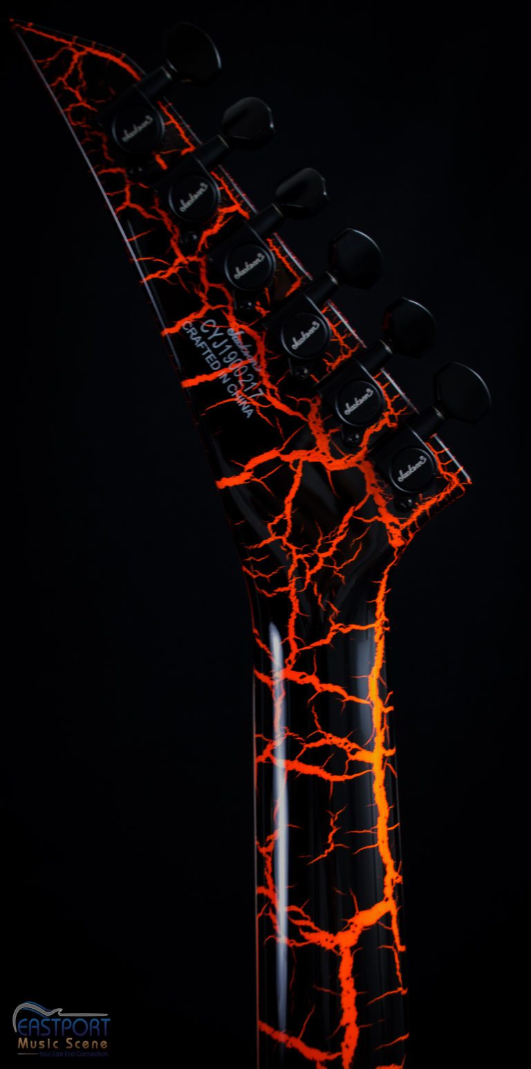 A guitar with red and black flames on it.