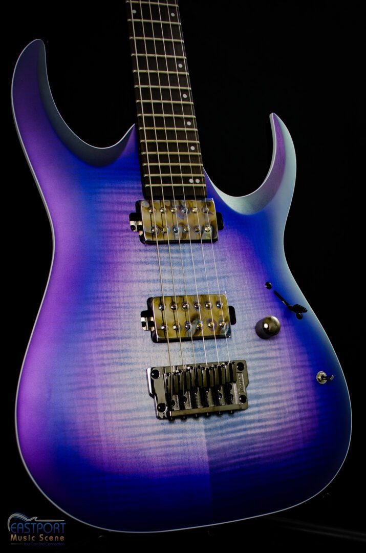 A purple electric guitar with yellow accents.