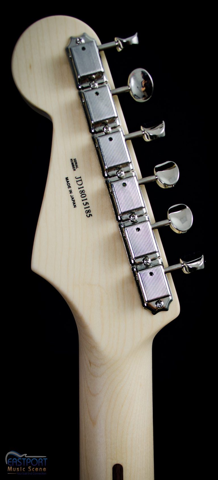 A close up of the back of an electric guitar