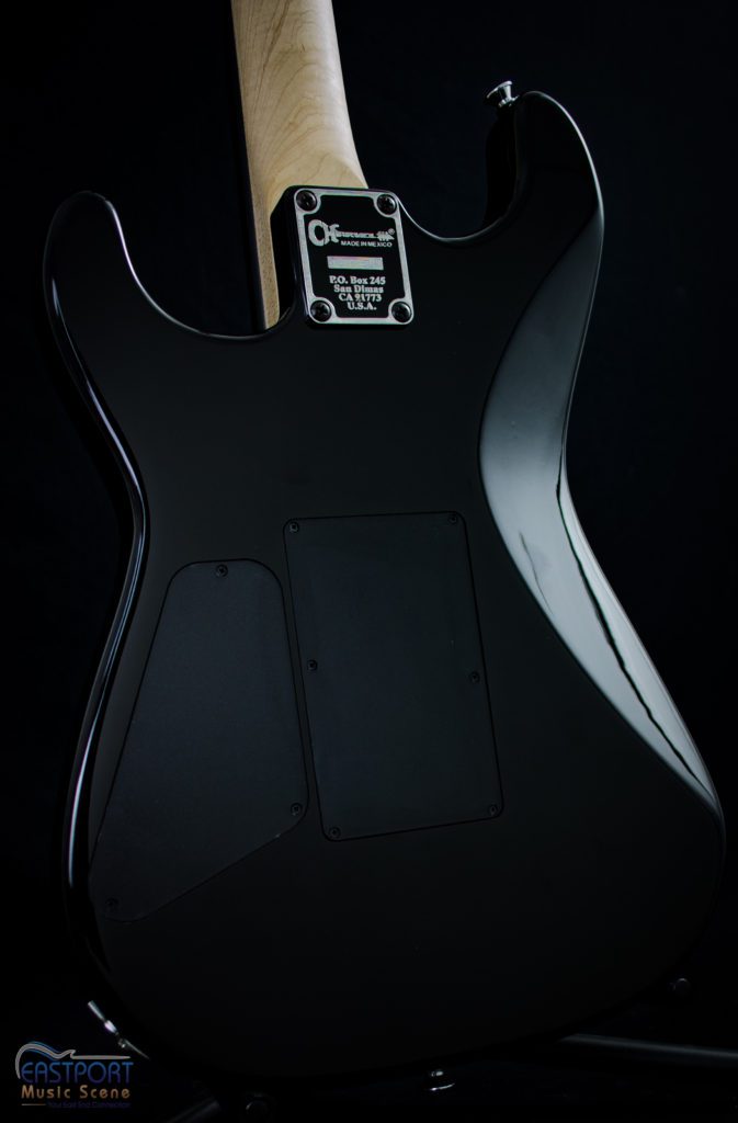 A black guitar with the back of it.