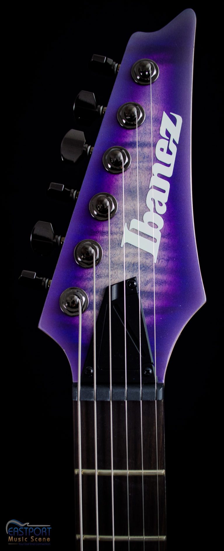 A purple guitar with the word " trance " on it.