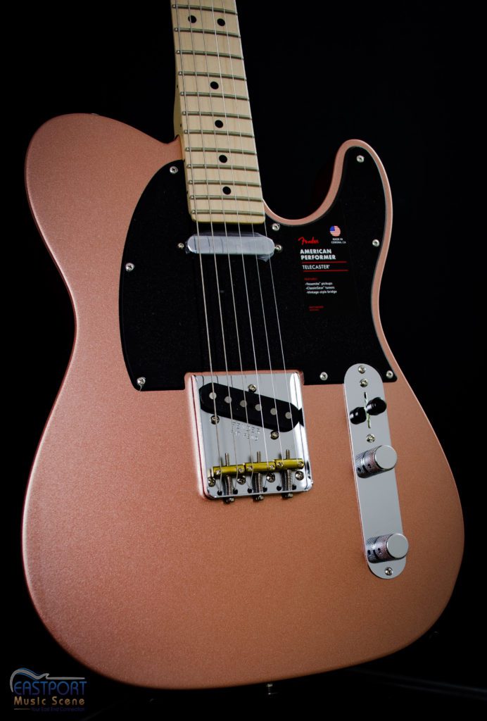 A close up of the neck and bridge on an electric guitar