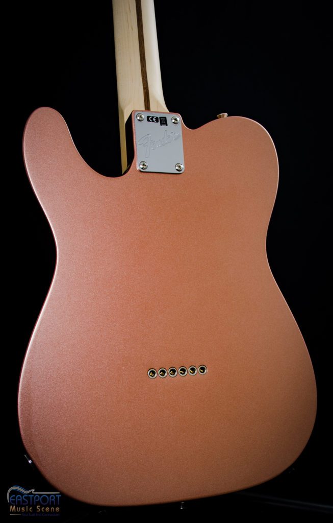 A close up of the back end of an electric guitar.