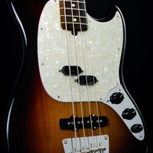 A close up of the front end of an electric bass guitar.