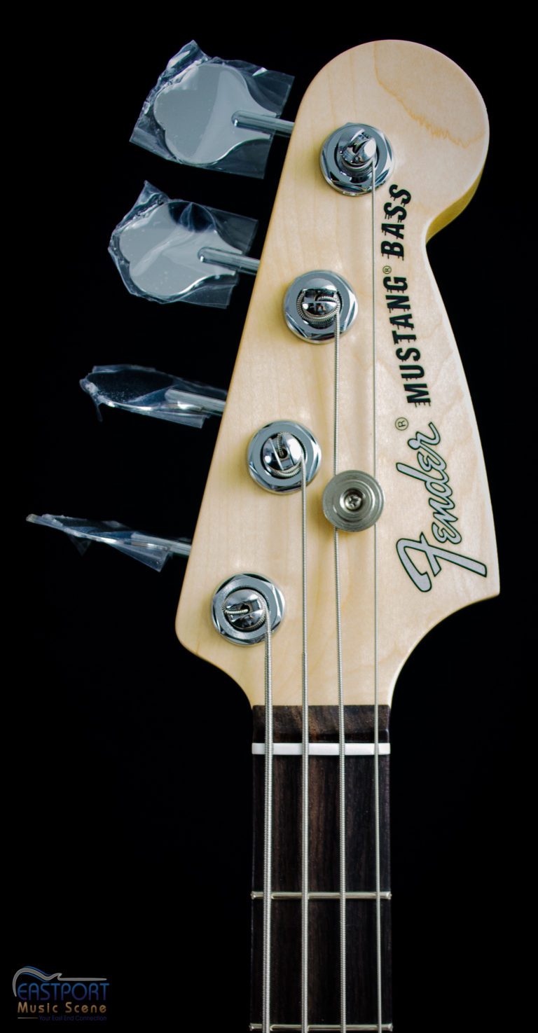 A close up of the headstock on an electric bass.