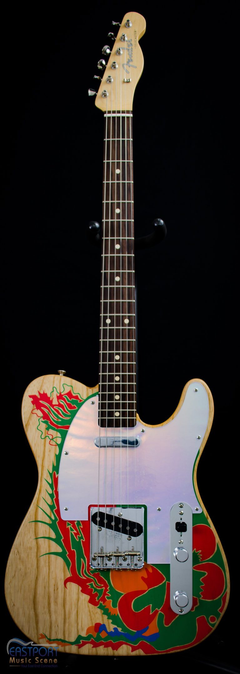A guitar with a picture of flowers on it.