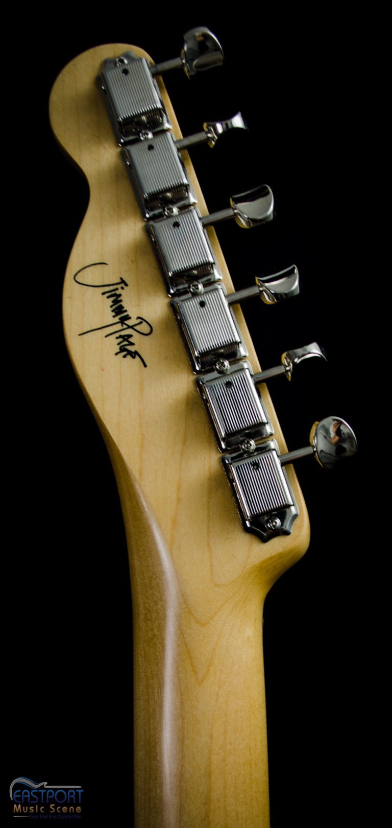 A close up of the headstock on an electric guitar.