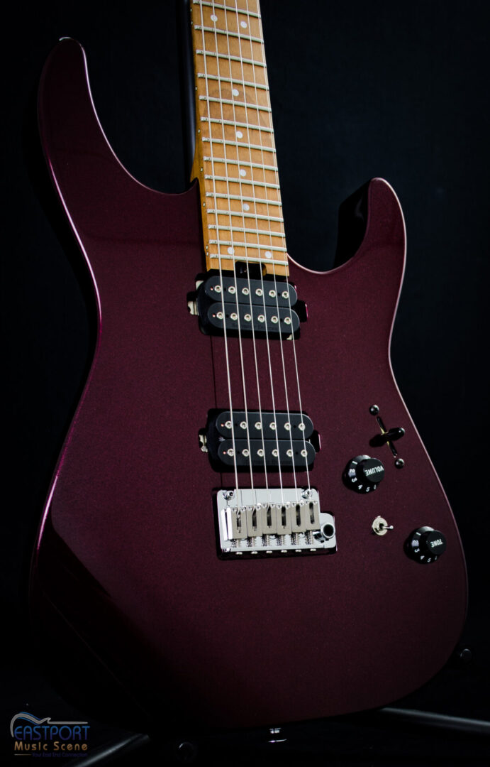 A close up of the neck and bridge on an electric guitar.