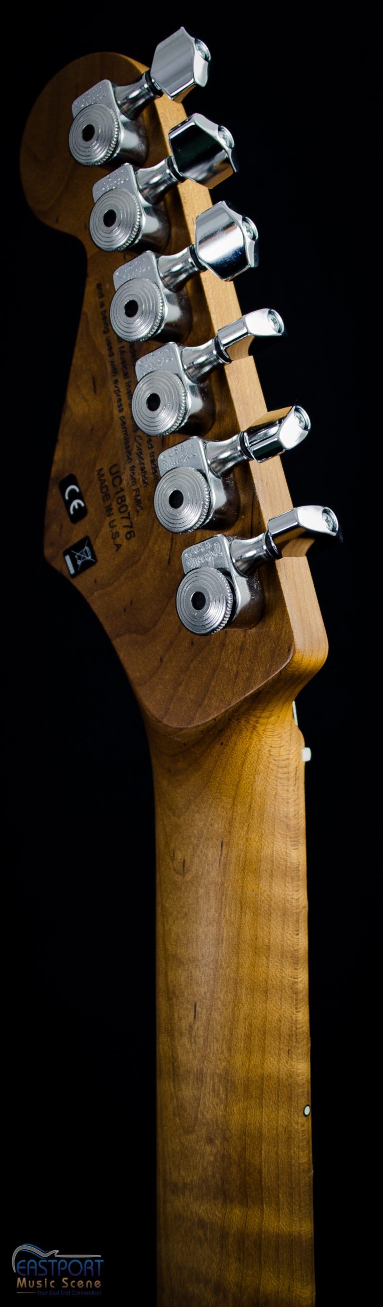 A close up of the back end of an electric guitar.