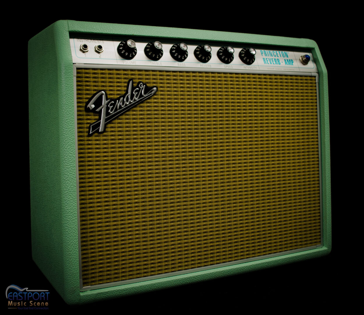A green and white fender amplifier with black knobs.