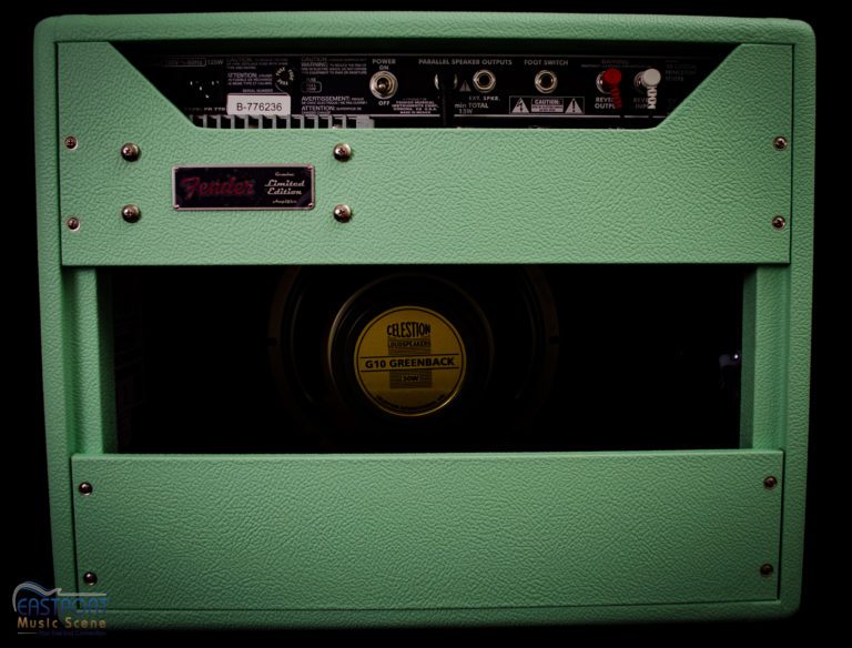 A green amp with yellow center panel and controls.