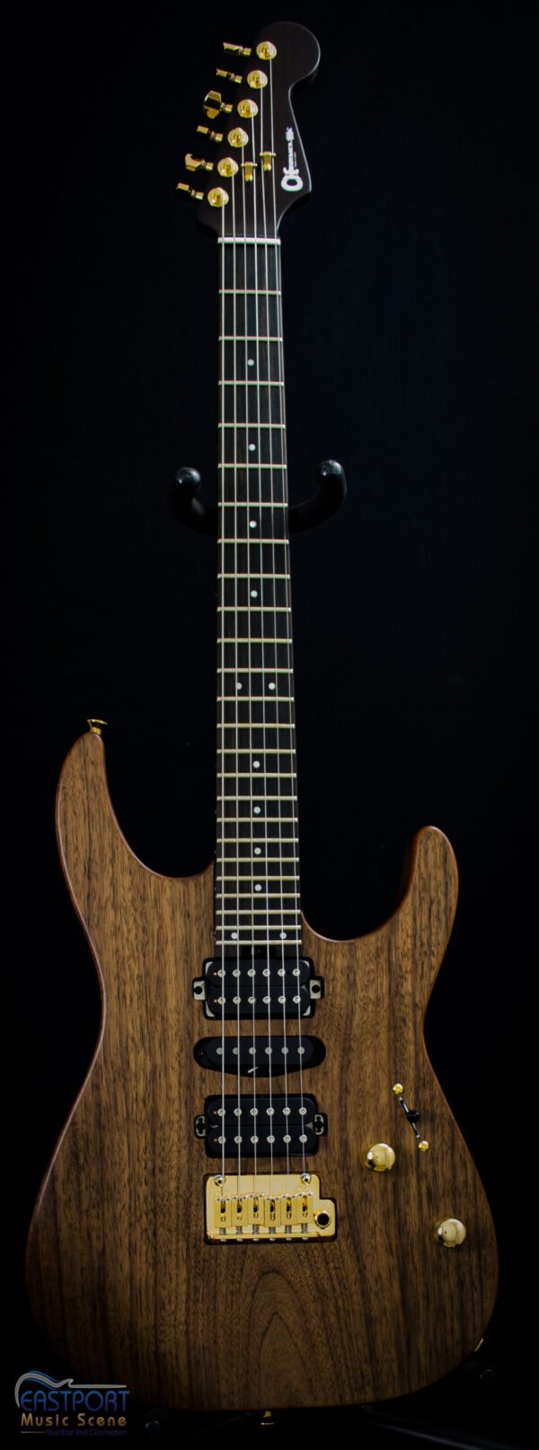 A guitar with a black string and wood finish.