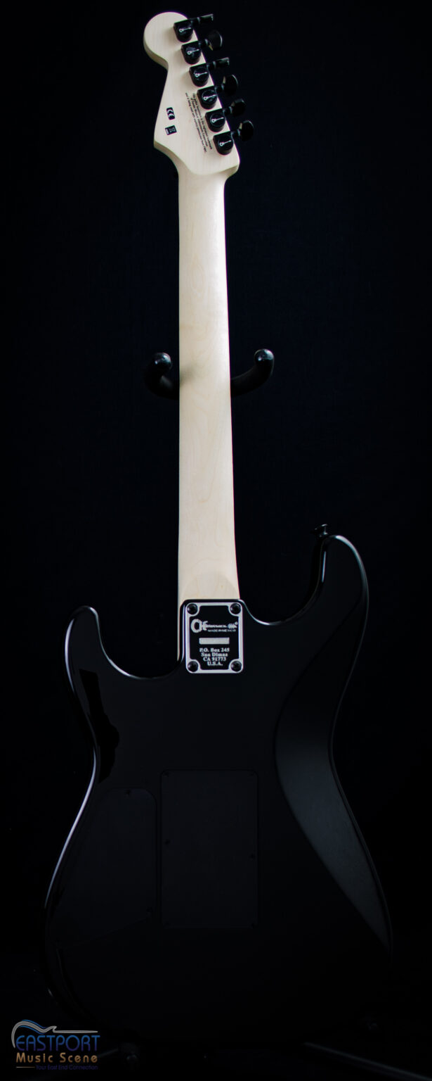 A black electric guitar with white handle and back.