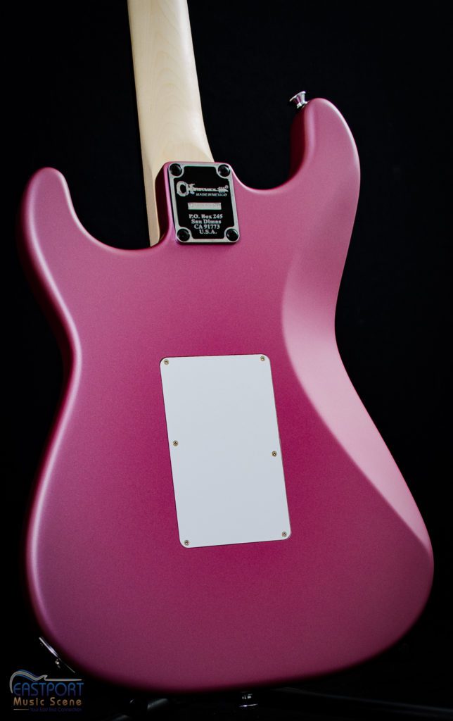 A pink guitar with a white neck and back