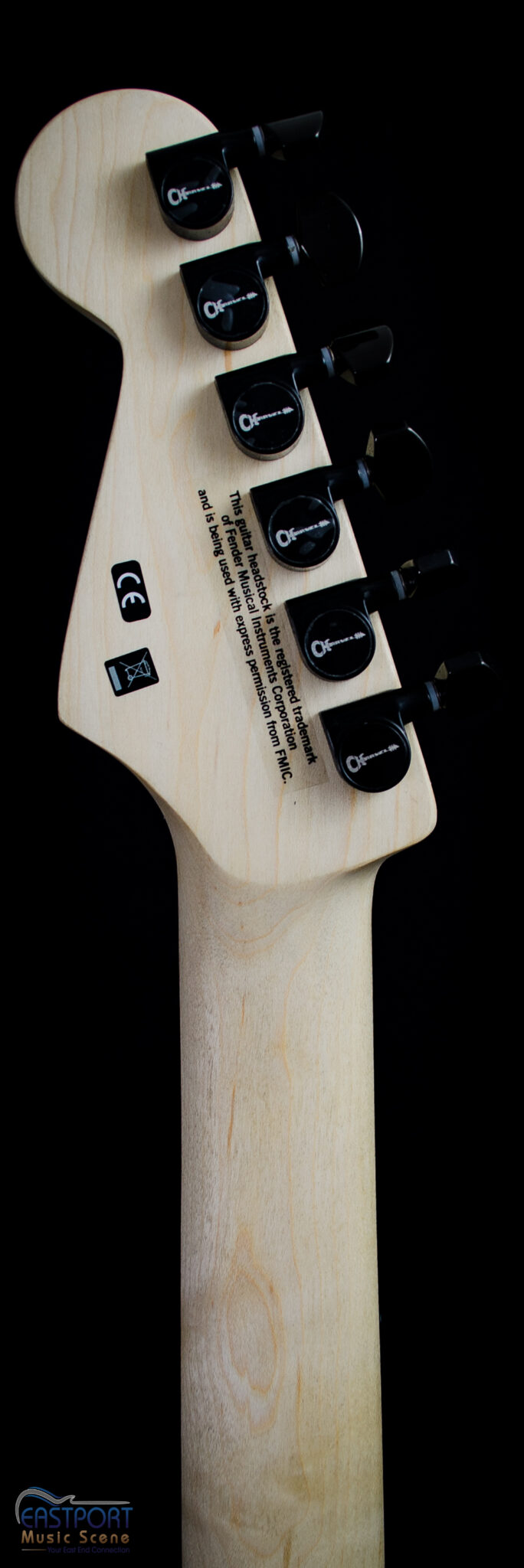 A close up of the controls on an electric guitar