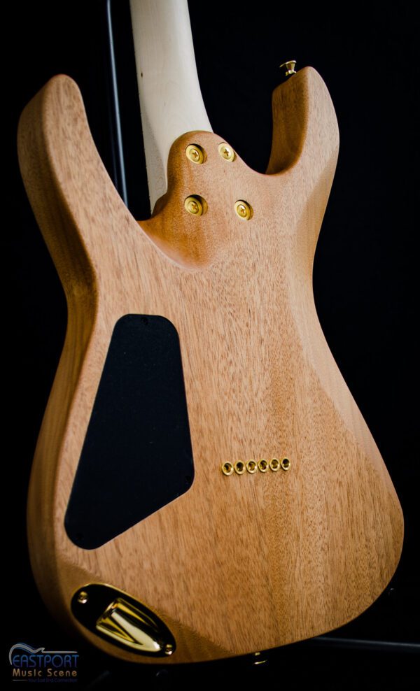 A close up of the neck and sides on an electric guitar.