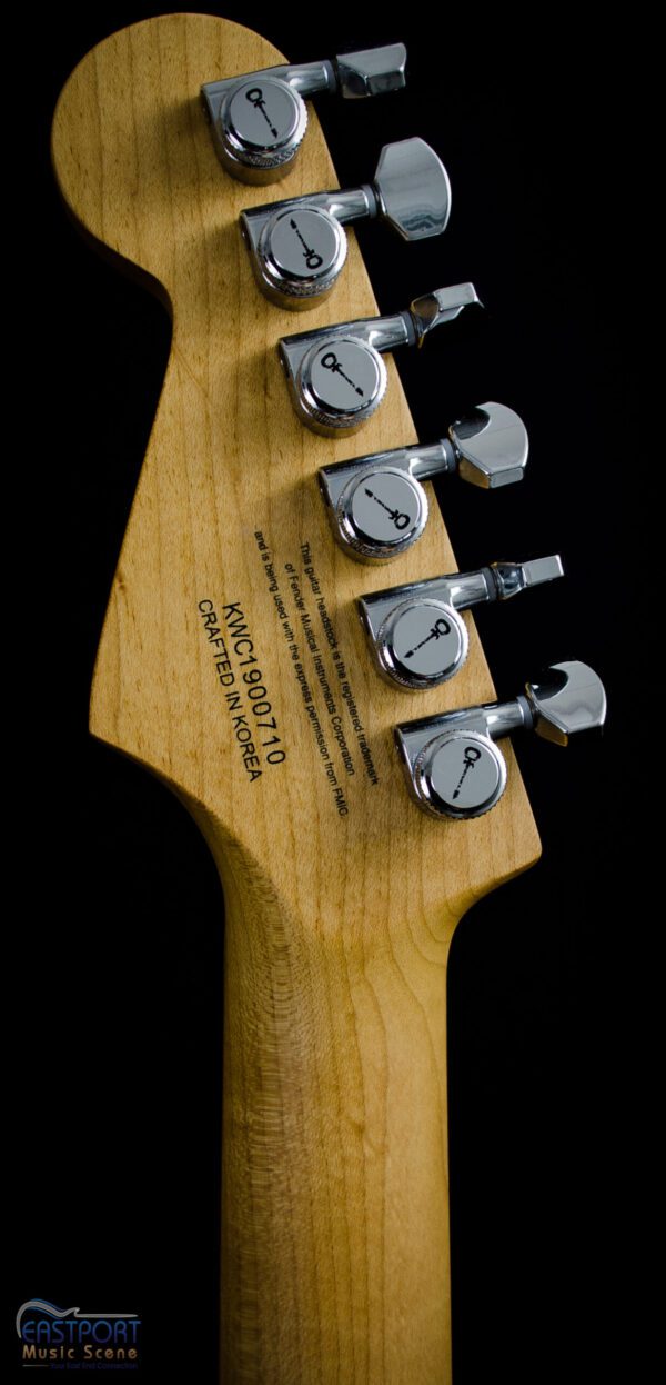 A close up of the headstock on an electric guitar