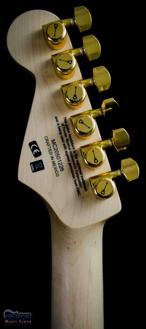 A guitar with four gold plated tuners.